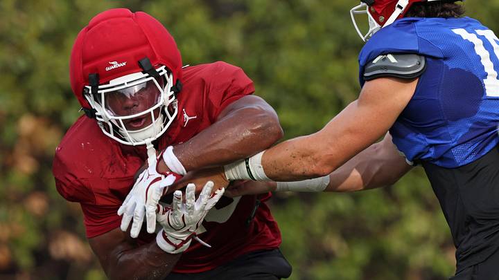 Oklahoma quarterback John Mateer, right, hands the ball off to Jonathan Hatton Jr. during football practice for the OU Sooners Oklahoma quarterback John Mateer, right, hands the ball off to Jonathan Hatton Jr. during football practice for the OU Sooners