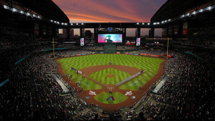 The sun sets as Diamondbacks players are introduced during Opening Day 2024 at Chase Field. The sun sets as Diamondbacks players are introduced during Opening Day 2024 at Chase Field.