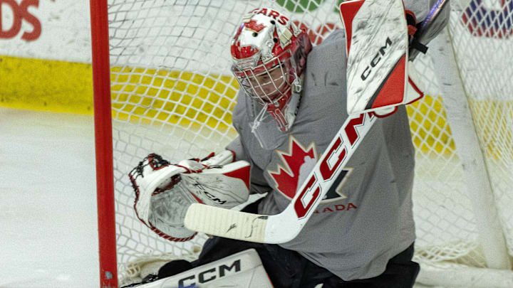 Aug 3, 2024; Plymouth, MI, USA; Canada's goaltender Joshua Ravensbergen (31) reacts to a shot against USA during the second period of the 2024 World Junior Summer Showcase at USA Hockey Arena. Mandatory Credit: David Reginek-Imagn Images