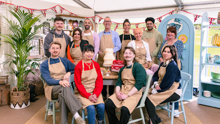 The Great British Bake Off. Back: Toby, Nadia, Aaron, Leighton, Jessika, Jasmine, Hassan, Lesley, Front: Tom, Pui Man, Iain, Nataliia Sitting in Cake Corner
