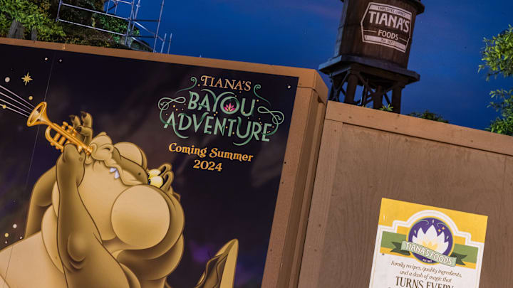 A new mural reveals the opening season for Tiana's Bayou Adventure at Walt Disney World Magic Kingdom Park in Lake Buena Vista, Fla. The new attraction opens this summer and will take guests on a musical adventure inspired by the beloved story and characters from the fan-favorite film “The Princess and the Frog.” Olga Thompson, photographer. © 2024 Disney. All Rights Reserved