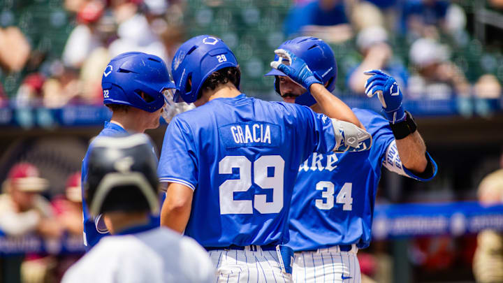 May 26, 2024; Charlotte, NC, USA; Duke Blue Devils infielder Ben Miller (34) celebrates with infielder Zac Morris (22) and utility AJ Gracia (29) after a 2 run home run against Florida State.