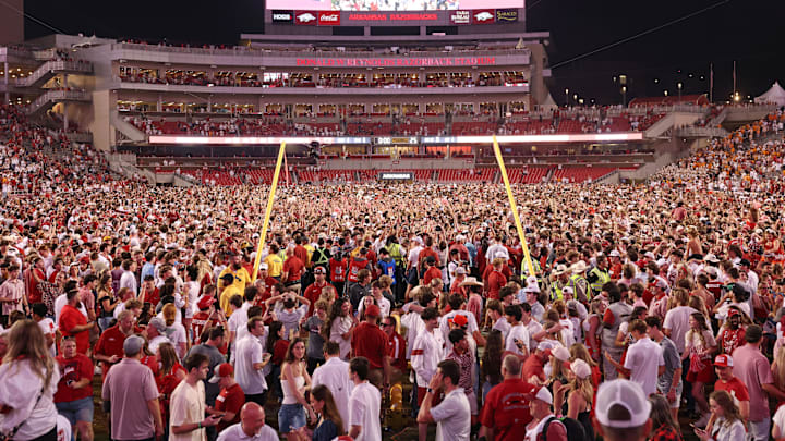Arkansas Razorbacks fans celebrate in front of the downed goal posts after the game against the Tennessee Volunteers at Razorback Stadium. Arkansas won 19-14. Arkansas Razorbacks fans celebrate in front of the downed goal posts after the game against the Tennessee Volunteers at Razorback Stadium. Arkansas won 19-14.
