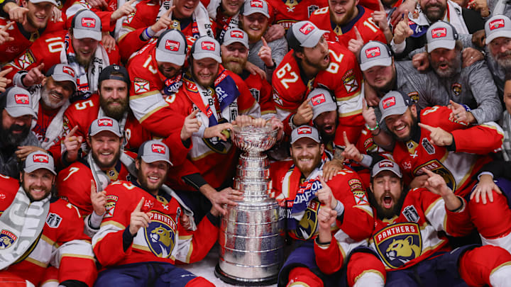 Jun 24, 2024; Sunrise, Florida, USA; The Florida Panthers pose with the cup for a team photo after winning game seven of the 2024 Stanley Cup Final against the Edmonton Oilers at Amerant Bank Arena. Mandatory Credit: Sam Navarro-Imagn Images
