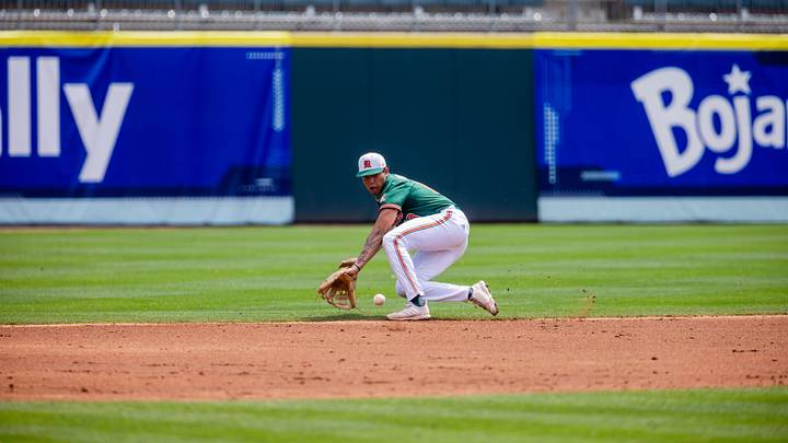 May 23, 2024; Charlotte, NC, USA; Miami (Fl) Hurricanes infielder Antonio Jimenez (13) field a ground ball against the Clemson Tigers during the second inning during the ACC Baseball Tournament at Truist Field. Mandatory Credit: Scott Kinser-USA TODAY Sports May 23, 2024; Charlotte, NC, USA; Miami (Fl) Hurricanes infielder Antonio Jimenez (13) field a ground ball against the Clemson Tigers during the second inning during the ACC Baseball Tournament at Truist Field. Mandatory Credit: Scott Kinser-USA TODAY Sports