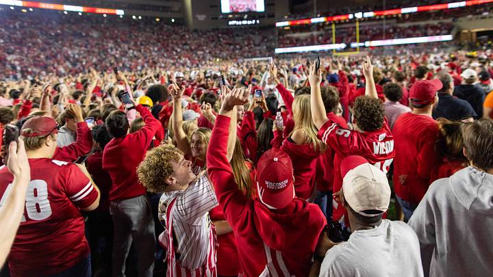 Wisconsin Badgers students and fans rush the field at Camp Randall Stadium Wisconsin Badgers students and fans rush the field at Camp Randall Stadium
