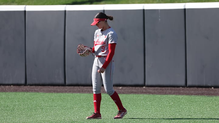 Nebraska softball's centerfielder Hannah Camenzind checks her wrist band for the pitch call during a 6-2 loss to Purdue.