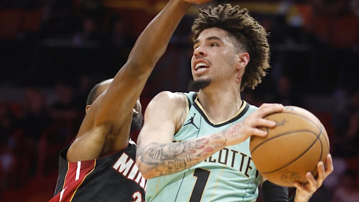 Mar 23, 2025; Miami, Florida, USA; Charlotte Hornets guard LaMelo Ball (1) is defended by Miami Heat forward Andrew Wiggins (22) during the first half at Kaseya Center. Mandatory Credit: Rhona Wise-Imagn Images Mar 23, 2025; Miami, Florida, USA; Charlotte Hornets guard LaMelo Ball (1) is defended by Miami Heat forward Andrew Wiggins (22) during the first half at Kaseya Center. Mandatory Credit: Rhona Wise-Imagn Images