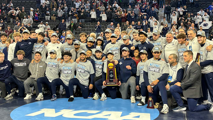 The Penn State wrestling team celebrates winning the team title at the 2025 NCAA Wrestling Championships.