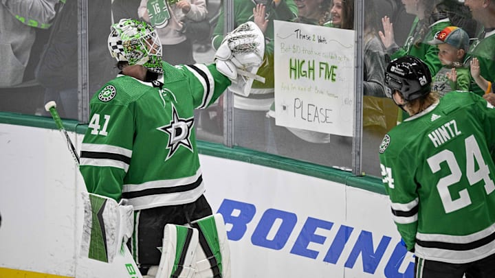 Apr 11, 2024; Dallas, Texas, USA; Dallas Stars goaltender Scott Wedgewood (41) gives a high five to a fan during warms up prior to a game against against the Winnipeg Jets at the American Airlines Center. Mandatory Credit: Jerome Miron-Imagn Images