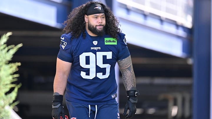 Jul 23, 2025; Foxborough, MA, USA; New England Patriots defensive tackle Khyiris Tonga (95)  walks to the practice field for training camp at Gillette Stadium.