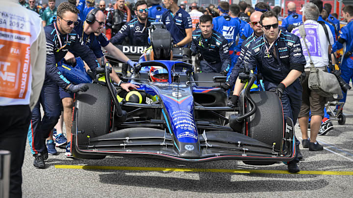 Oct 23, 2022; Austin, Texas, USA; The crew of Williams Racing driver Nicholas Latifi (6) of Team Canada wheel their car onto the grid before the start of the U.S. Grand Prix F1 race at Circuit of the Americas. Mandatory Credit: Jerome Miron-Imagn Images