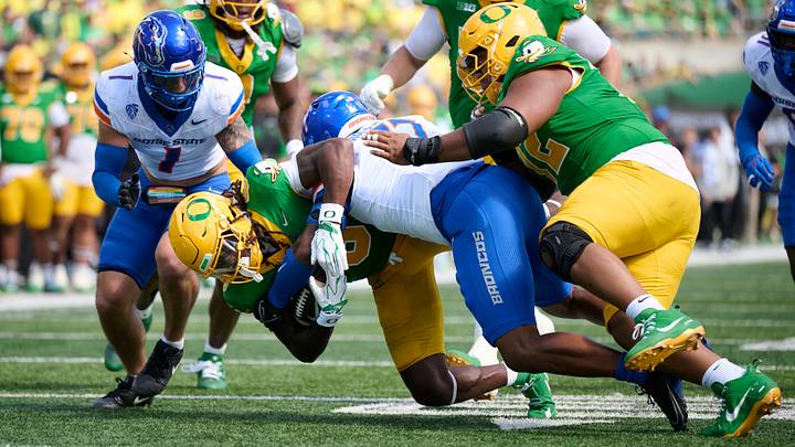 Oregon running back Dierre Hill Jr. is tackled by Boise State linebacker Logan Brantley. Oregon running back Dierre Hill Jr. is tackled by Boise State linebacker Logan Brantley.