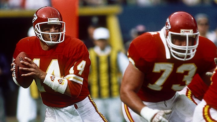 Oct 12, 1986; Cleveland, OH, USA; FILE PHOTO; Kansas City Chiefs quarterback Todd Blackledge (14) and guard Brian Jozwiak (73) in action against the Cleveland Browns at Cleveland Municipal Stadium. Mandatory Credit: Malcolm Emmons-USA TODAY NETWORK