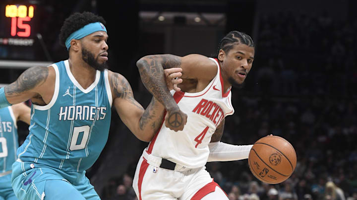 Dec 23, 2024; Charlotte, North Carolina, USA; Houston Rockets guard Jalen Green (4) drives past Charlotte Hornets forward Miles Bridges (0) during the second half at the Spectrum Center. Mandatory Credit: Sam Sharpe-Imagn Images Dec 23, 2024; Charlotte, North Carolina, USA; Houston Rockets guard Jalen Green (4) drives past Charlotte Hornets forward Miles Bridges (0) during the second half at the Spectrum Center. Mandatory Credit: Sam Sharpe-Imagn Images