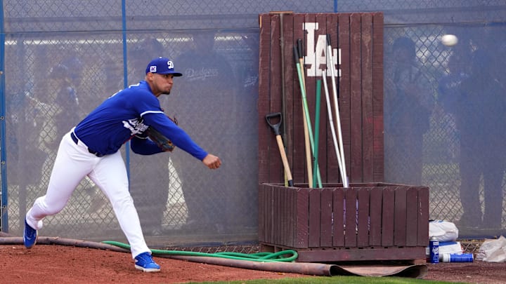 Feb 16, 2025; Glendale, AZ, USA; Los Angeles Dodgers pitcher Edgardo Henriquez (60) throws during a Spring Training workout at Camelback Ranch. Mandatory Credit: Joe Camporeale-Imagn Images
