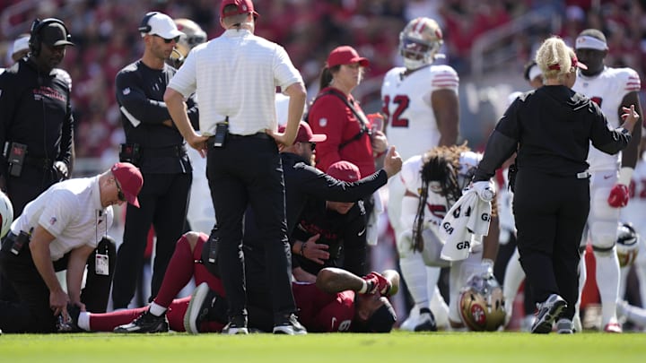 Sep 21, 2025; Santa Clara, California, USA; Medical personal tend to Arizona Cardinals running back James Conner (6) during the second half against the San Francisco 49ers at Levi's Stadium. Mandatory Credit: Kyle Terada-Imagn Images