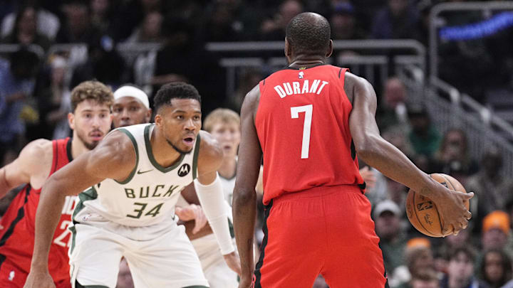 Nov 9, 2025; Milwaukee, Wisconsin, USA; Milwaukee Bucks forward Giannis Antetokounmpo (34) defends against Houston Rockets forward Kevin Durant (7) in the second half at Fiserv Forum. Mandatory Credit: Michael McLoone-Imagn Images