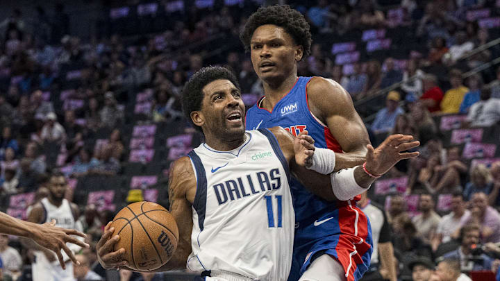 Oct 20, 2023; Dallas, Texas, USA; Dallas Mavericks guard Kyrie Irving (11) and Detroit Pistons forward Ausar Thompson (9) in action during the game between the Dallas Mavericks and the Detroit Pistons at the American Airlines Center. Mandatory Credit: Jerome Miron-USA TODAY Sports