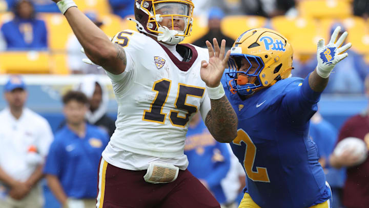 Sep 6, 2025; Pittsburgh, Pennsylvania, USA;  Central Michigan Chippewas quarterback Jadyn Glasser (15) passes against pressure from Pittsburgh Panthers defensive lineman Isaiah Neal (2) during the fourth quarter at Acrisure Stadium. Mandatory Credit: Charles LeClaire-Imagn Images