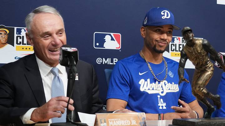 Los Angeles Dodgers shortstop Mookie Betts (50) is awarded the Roberto Clemente Award by Major League Basesball commissioner Rob Manfred