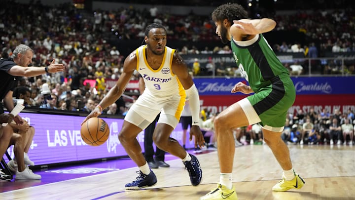 Jul 15, 2024; Las Vegas, NV, USA; Los Angeles Lakers guard Bronny James (9) dribbles the ball against Boston Celtics forward Anton Watson (28) during the first half at Thomas & Mack Center. Mandatory Credit: Lucas Peltier-Imagn Images