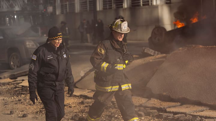 CHICAGO FIRE -- "In The Trenches: Part I" Episode 13011 -- Pictured: (l-r) Amy Morton as Desk Sgt. Trudy Platt, Dermot Mulroney as Chief Dom Pascal -- (Photo by: Peter Gordon/NBC)