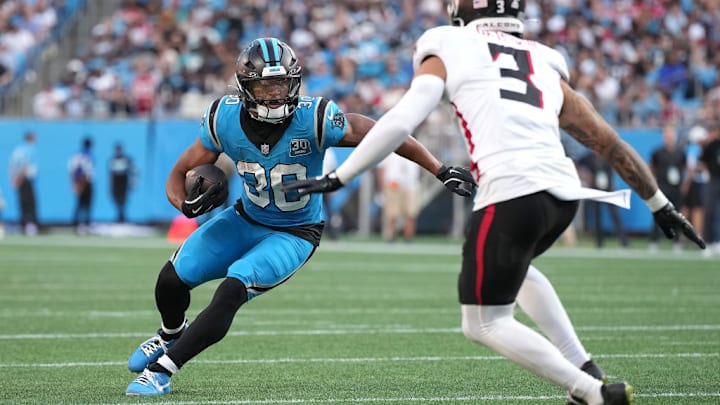 CHARLOTTE, NORTH CAROLINA - OCTOBER 13: Chuba Hubbard #30 of the Carolina Panthers runs against Jessie Bates III #3 of the Atlanta Falcons in the second quarter at Bank of America Stadium on October 13, 2024 in Charlotte, North Carolina. CHARLOTTE, NORTH CAROLINA - OCTOBER 13: Chuba Hubbard #30 of the Carolina Panthers runs against Jessie Bates III #3 of the Atlanta Falcons in the second quarter at Bank of America Stadium on October 13, 2024 in Charlotte, North Carolina.