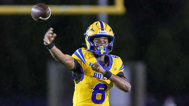 Sophomore quarterback Neimann Lawrence throws a pass for Miami Northwestern in a game against Miami Central during the 2025 season.