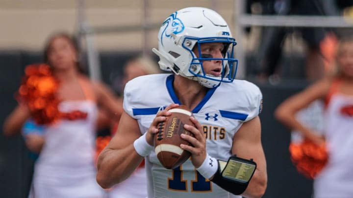 Aug 31, 2024; Stillwater, Oklahoma, USA; South Dakota State Jackrabbits quarterback Mark Gronowski (11) looks to pass during the first quarter against the Oklahoma State Cowboys at Boone Pickens Stadium. Mandatory Credit: William Purnell-Imagn Images