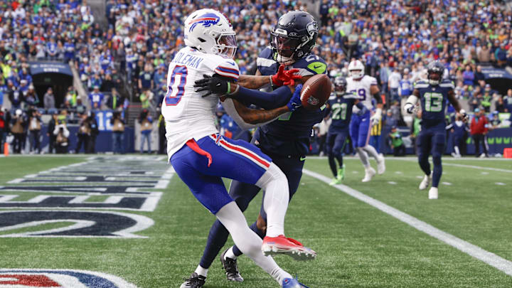 Oct 27, 2024; Seattle, Washington, USA; Seattle Seahawks cornerback Riq Woolen (27) breaks up a potential touchdown pass to Buffalo Bills wide receiver Keon Coleman (0) during the first quarter at Lumen Field. 