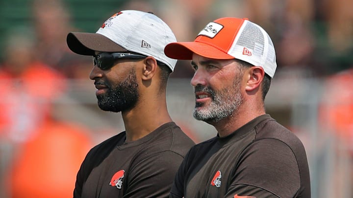 Browns GM Andrew Berry, left, and coach Kevin Stefanski watch practice in training camp, Saturday, July 31, 2021, in Berea.