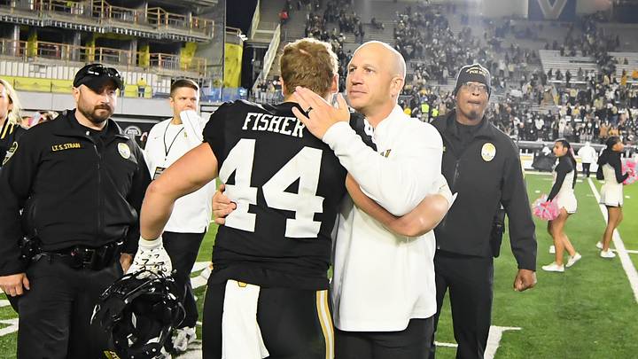 Oct 19, 2024; Nashville, Tennessee, USA; Vanderbilt Commodores head coach Clark Lea hugs fullback Gabe Fisher (44) after the win against the Ball State Cardinals during the second half at FirstBank Stadium. Mandatory Credit: Steve Roberts-Imagn Images Oct 19, 2024; Nashville, Tennessee, USA; Vanderbilt Commodores head coach Clark Lea hugs fullback Gabe Fisher (44) after the win against the Ball State Cardinals during the second half at FirstBank Stadium. Mandatory Credit: Steve Roberts-Imagn Images