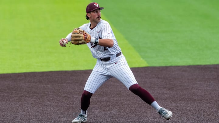 Blacksburg, VA — Owen Petrich loads to throw to first base against Clemson in game 1, 2026.