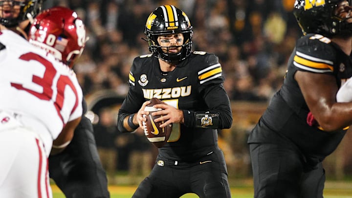 Nov 9, 2024; Columbia, Missouri, USA; Missouri Tigers quarterback Drew Pyne (6) drops back to pass during the first half against the Oklahoma Sooners at Faurot Field at Memorial Stadium. Mandatory Credit: Jay Biggerstaff-Imagn Images