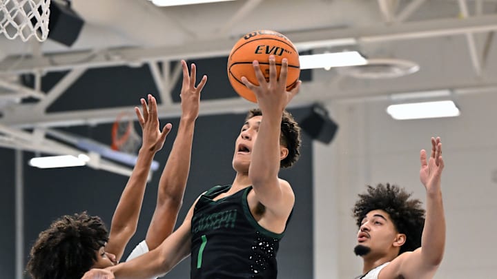 Julius Price, of No. 3 St. Joseph-Santa Maria, swoops in for two of his 16 points in Saturday's 76-67 win over No. 9 Salesian in the Crush in the Valley Showcase in San Pablo Calif. St. Joseph is the No. 1 seed in Division 1 of the Central Section. Playoffs began in five of the six divisions except D1. All quarterfinal games are slated for Wednesday. 