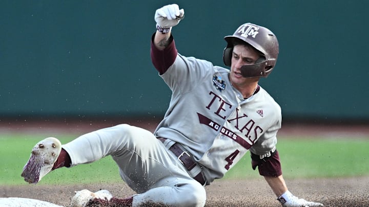 Texas A&M Aggies center fielder Travis Chestnut (4) slides into second base on an error against the Tennessee Volunteers during the third inning at Charles Schwab Field Omaha. Texas A&M Aggies center fielder Travis Chestnut (4) slides into second base on an error against the Tennessee Volunteers during the third inning at Charles Schwab Field Omaha.