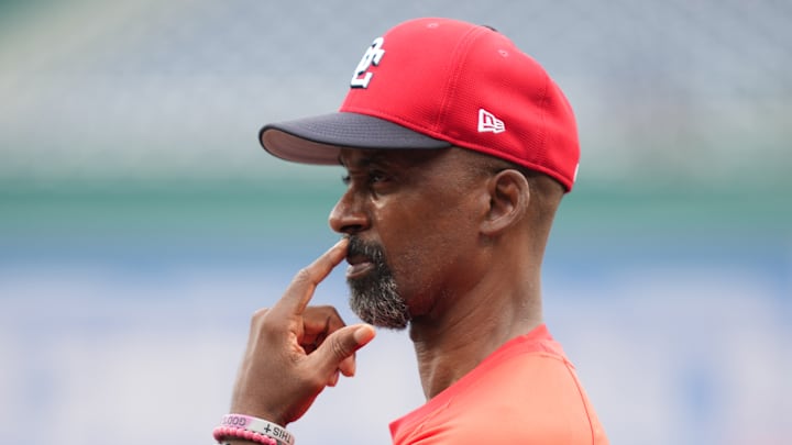 Hitting coach Darnell Coach contemplating why his offense can't produce.