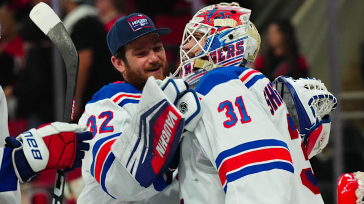 May 16, 2024; Raleigh, North Carolina, USA; New York Rangers goaltender Igor Shesterkin (31) and goaltender Jonathan Quick (32) celebrate their victory against the Carolina Hurricanes in game six of the second round of the 2024 Stanley Cup Playoffs at PNC Arena. Mandatory Credit: James Guillory-Imagn Images May 16, 2024; Raleigh, North Carolina, USA; New York Rangers goaltender Igor Shesterkin (31) and goaltender Jonathan Quick (32) celebrate their victory against the Carolina Hurricanes in game six of the second round of the 2024 Stanley Cup Playoffs at PNC Arena. Mandatory Credit: James Guillory-Imagn Images