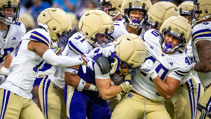 Ezaya Tokio pulls down a ball carrier at the goal line during the Spring Game. Ezaya Tokio pulls down a ball carrier at the goal line during the Spring Game.