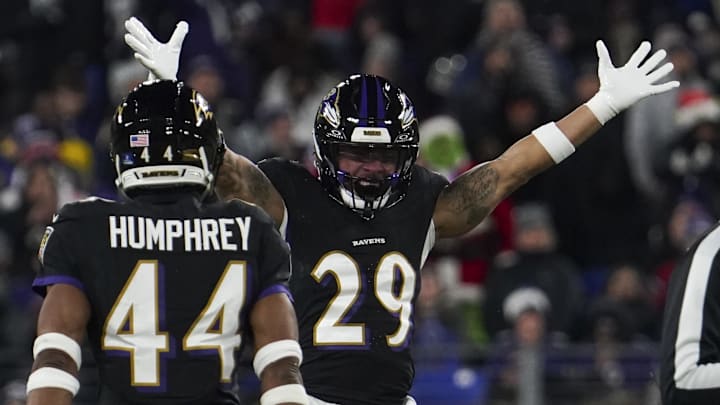Baltimore Ravens safety Ar'Darius Washington (29) celebrates forcing a fumble by New England Patriots quarterback Drake Maye (not pictured) during the first half of the game at M&T Bank Stadium. 
