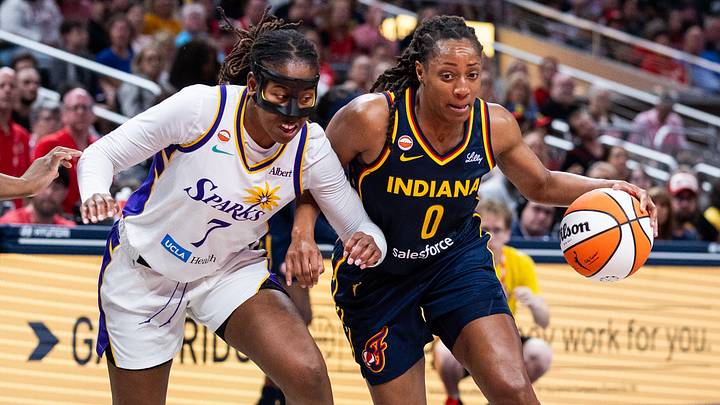 Jun 27, 2026; Indianapolis, Indiana, USA; Indiana Fever guard Kelsey Mitchell (0) dribbles the ball while Los Angeles Sparks guard Ariel Atkins (7) defends in the second half at Gainbridge Fieldhouse. Mandatory Credit: Trevor Ruszkowski-Imagn Images Jun 27, 2026; Indianapolis, Indiana, USA; Indiana Fever guard Kelsey Mitchell (0) dribbles the ball while Los Angeles Sparks guard Ariel Atkins (7) defends in the second half at Gainbridge Fieldhouse. Mandatory Credit: Trevor Ruszkowski-Imagn Images