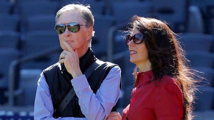 Oct 1, 2025; Bronx, New York, USA; Boston Red Sox owner John Henry (left) stands on the field with his wife Linda Pizzuti Henry during batting practice before game two of the Wildcard round of the 2025 MLB playoffs against the New York Yankees at Yankee Stadium. Mandatory Credit: Brad Penner-Imagn Images Oct 1, 2025; Bronx, New York, USA; Boston Red Sox owner John Henry (left) stands on the field with his wife Linda Pizzuti Henry during batting practice before game two of the Wildcard round of the 2025 MLB playoffs against the New York Yankees at Yankee Stadium. Mandatory Credit: Brad Penner-Imagn Images