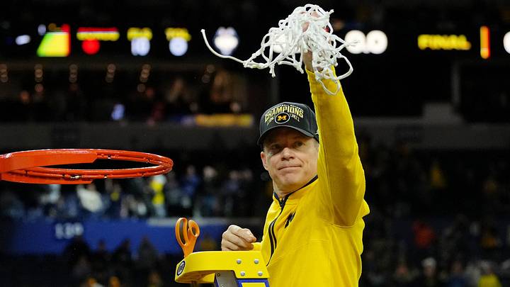 Apr 6, 2026; Indianapolis, IN, USA; Michigan Wolverines head coach Dusty May waves to fans after cutting the net after their win against the UConn Huskies in the national championship of the Final Four of the men's 2026 NCAA Tournament between the and the Michigan Wolverines at Lucas Oil Stadium. Mandatory Credit: Bob Donnan-Imagn Images Apr 6, 2026; Indianapolis, IN, USA; Michigan Wolverines head coach Dusty May waves to fans after cutting the net after their win against the UConn Huskies in the national championship of the Final Four of the men's 2026 NCAA Tournament between the and the Michigan Wolverines at Lucas Oil Stadium. Mandatory Credit: Bob Donnan-Imagn Images