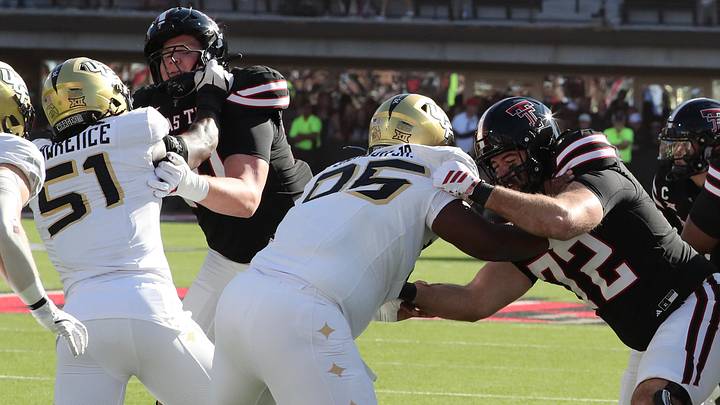 Nov 15, 2025; Lubbock, Texas, USA; Texas Tech Red Raiders offensive lineman Sheridan Wilson (72) and offensive lineman Jacob Ponton (70) blocks Central Florida Knights defensive end Malachi Lawrence (51) and defensive tackle RJ Jackson Jr. (95) in the first half at Jones AT&T Stadium. Mandatory Credit: Michael C. Johnson-Imagn Images Nov 15, 2025; Lubbock, Texas, USA; Texas Tech Red Raiders offensive lineman Sheridan Wilson (72) and offensive lineman Jacob Ponton (70) blocks Central Florida Knights defensive end Malachi Lawrence (51) and defensive tackle RJ Jackson Jr. (95) in the first half at Jones AT&T Stadium. Mandatory Credit: Michael C. Johnson-Imagn Images