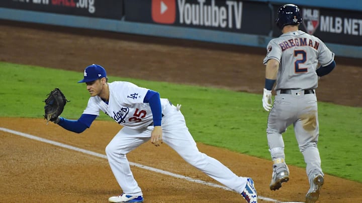 Oct 31, 2017; Los Angeles, CA, USA; Los Angeles Dodgers first baseman Cody Bellinger (35) forces out Houston Astros third baseman Alex Bregman (2) in the fifth inning in game six of the 2017 World Series at Dodger Stadium. Mandatory Credit: Jayne Kamin-Oncea-Imagn Images
