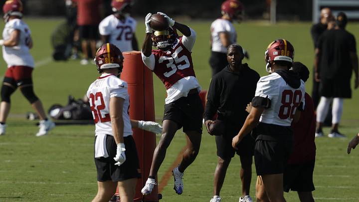 Jul 24, 2025; Ashburn, VA, USA; Washington Commanders safety Percy Butler (35) catches a ball during practice on day two of training camp at OrthoVirginia Training Center at Commanders Park. Mandatory Credit: Geoff Burke-Imagn Images Jul 24, 2025; Ashburn, VA, USA; Washington Commanders safety Percy Butler (35) catches a ball during practice on day two of training camp at OrthoVirginia Training Center at Commanders Park. Mandatory Credit: Geoff Burke-Imagn Images