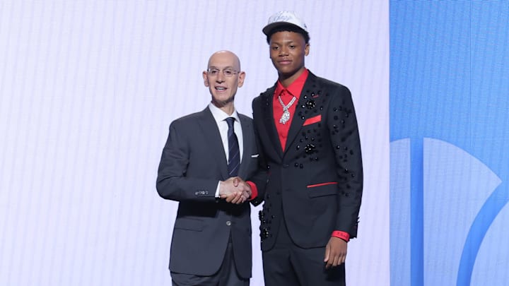 Adam Silver (left) and Ace Bailey (right) pose after Bailey's selection in the NBA draft. Adam Silver (left) and Ace Bailey (right) pose after Bailey's selection in the NBA draft.