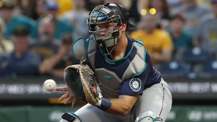 Seattle Mariners catcher Cal Raleigh takes a throw at home during a game against the Pittsburgh Pirates on Aug. 16 at PNC Park. Seattle Mariners catcher Cal Raleigh takes a throw at home during a game against the Pittsburgh Pirates on Aug. 16 at PNC Park.