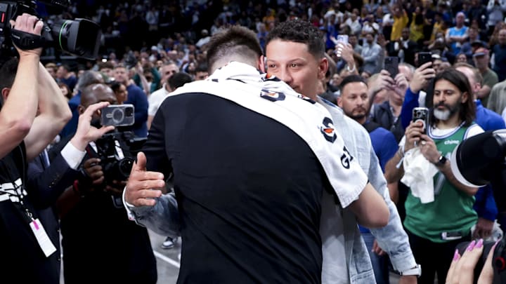 Los Angeles Lakers guard Doncic hugs Kansas City Chiefs quarterback Mahomes after the game against the Dallas Mavericks at American Airlines Center. 